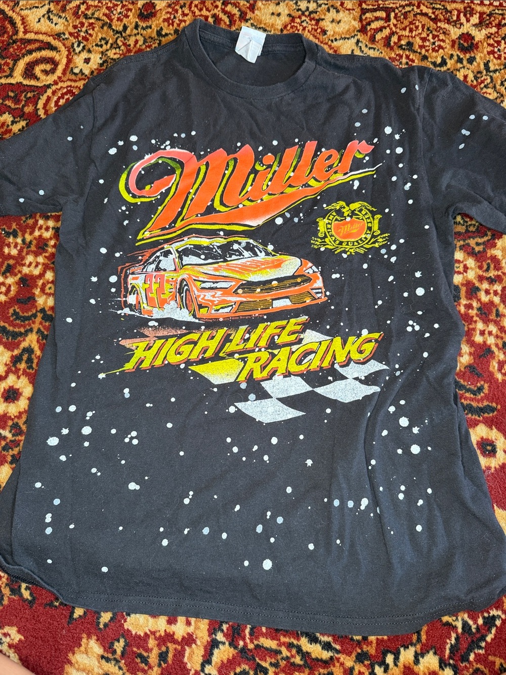 Junk Food Clothing Black Graphic Tee with Red & Blue Tag